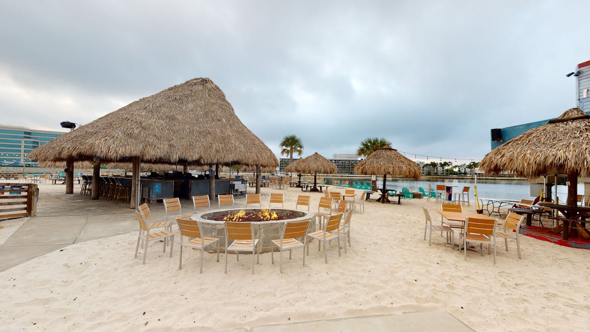 fire pit and chairs on the beach