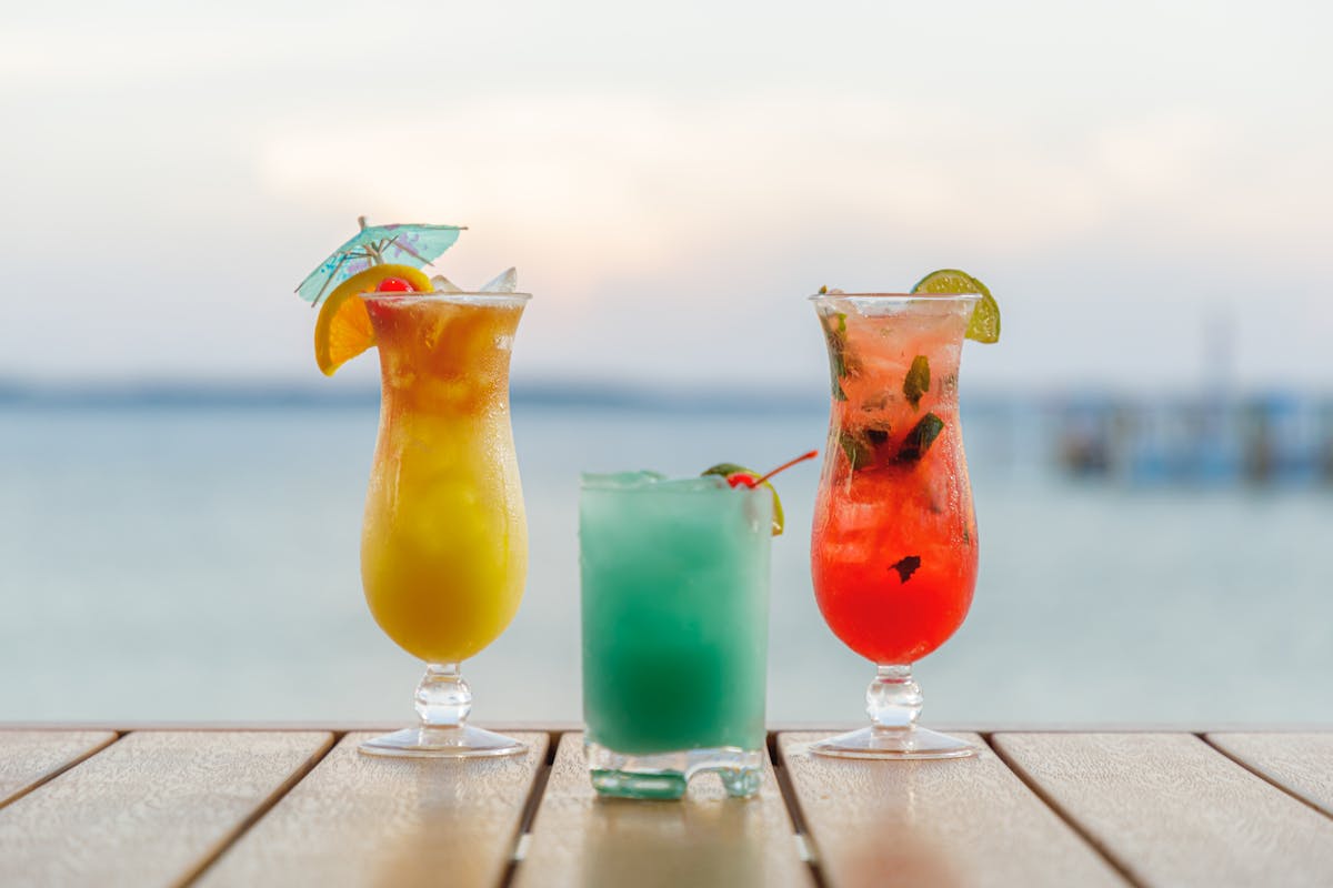 three cocktails on table