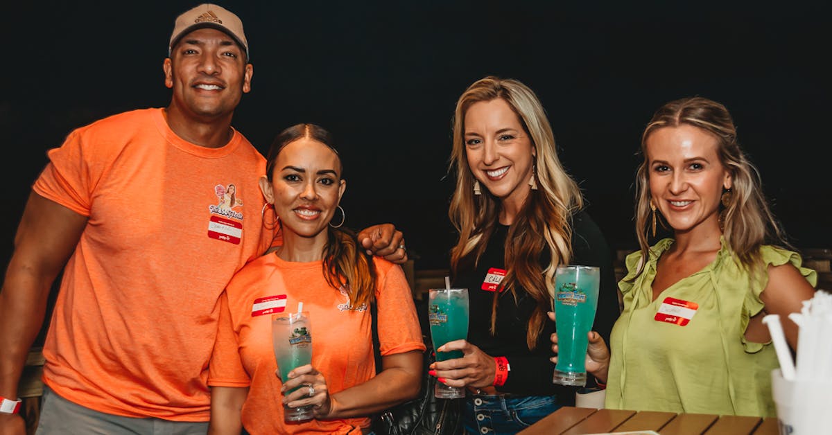 group of women and men with drinks in their hands