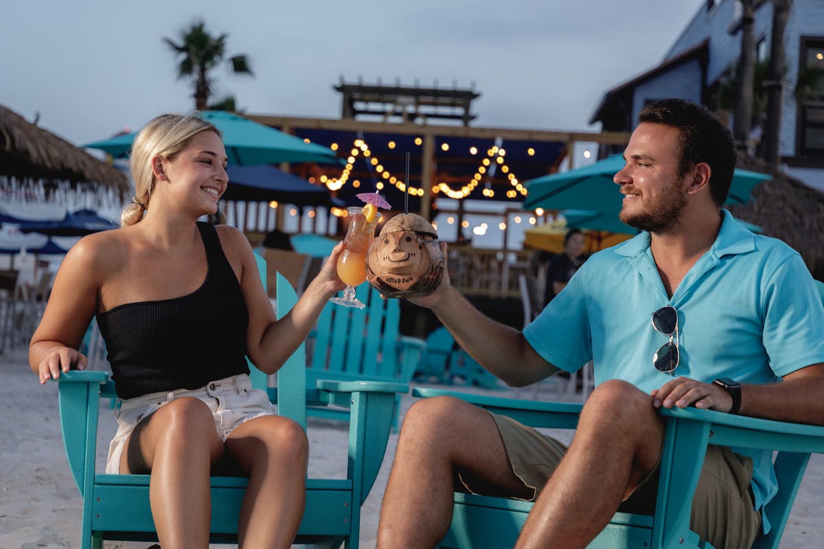 a man and women raising a toast