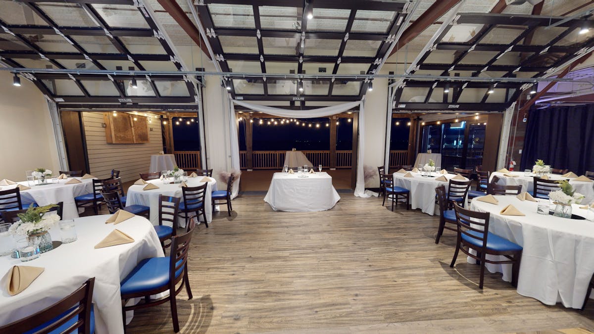 event room decorated with tables and chairs