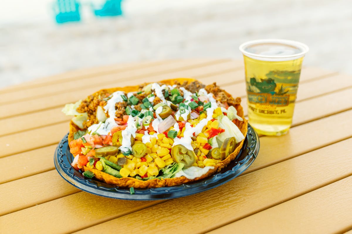 a plate of food and a beer