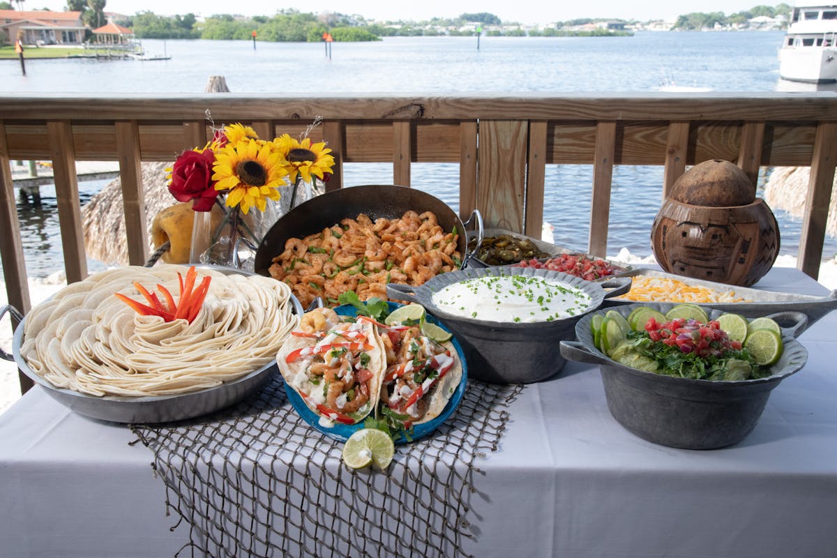 a buffet style table by the beach