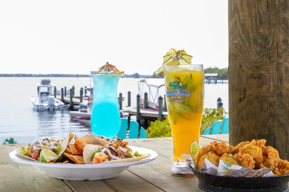 plates of food and cocktails