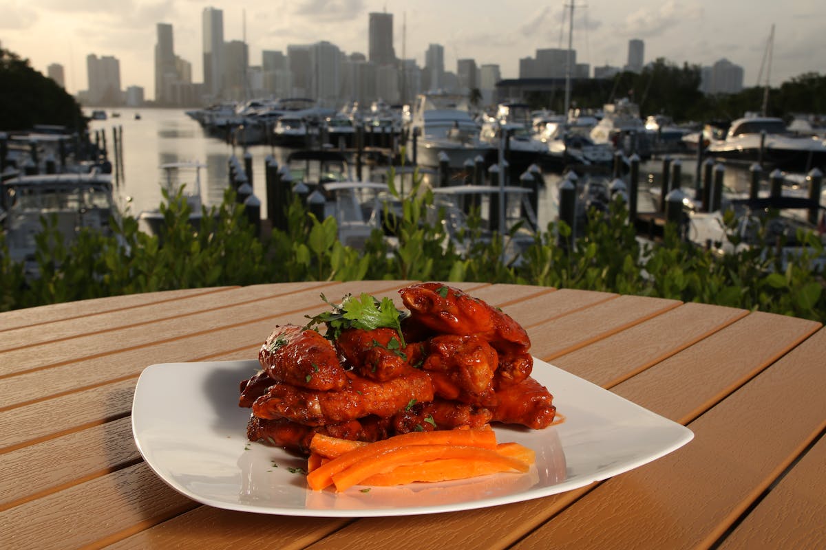 a plate of food with a view of the city in the background