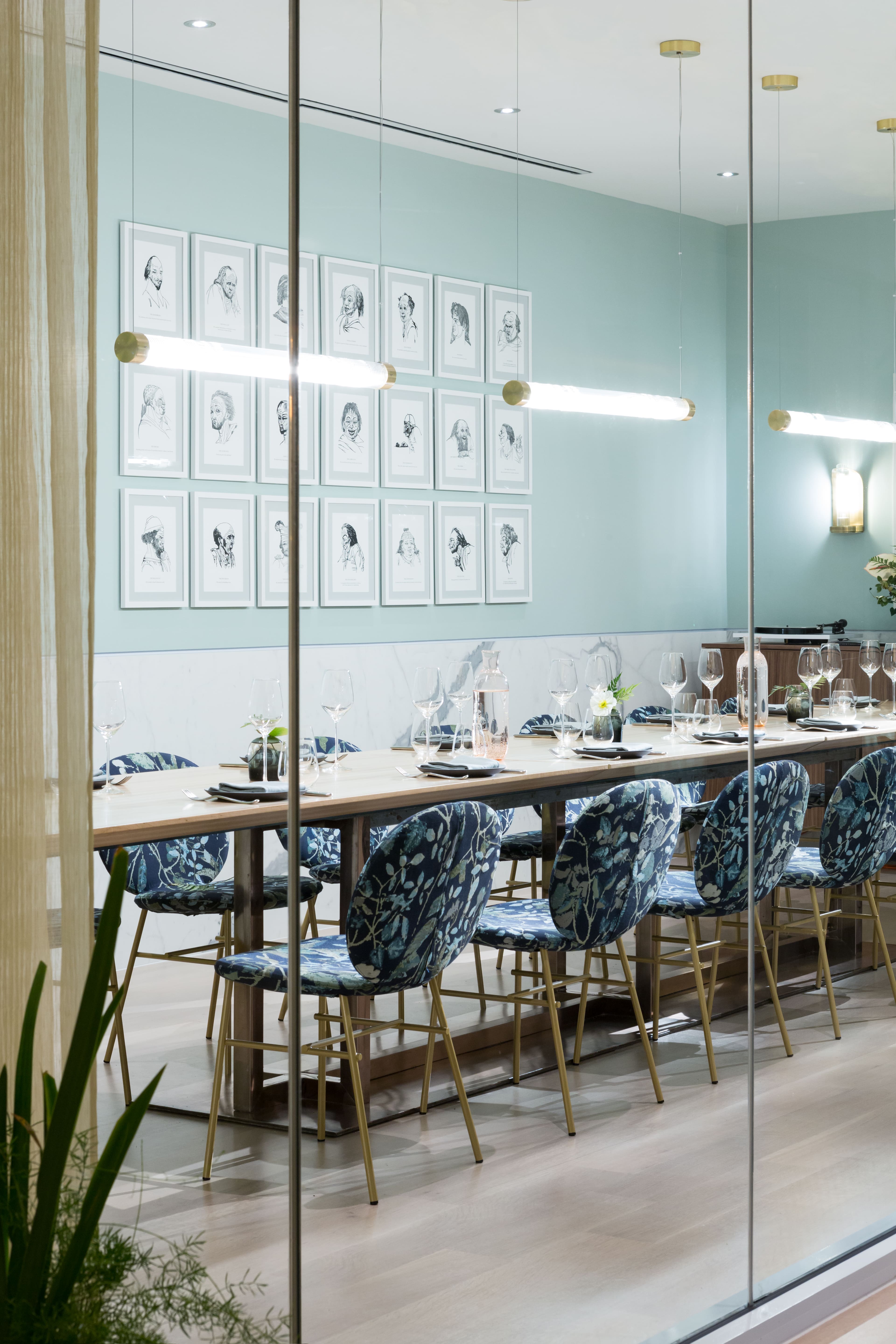 Private dining room with floral blue chairs and long wooden table