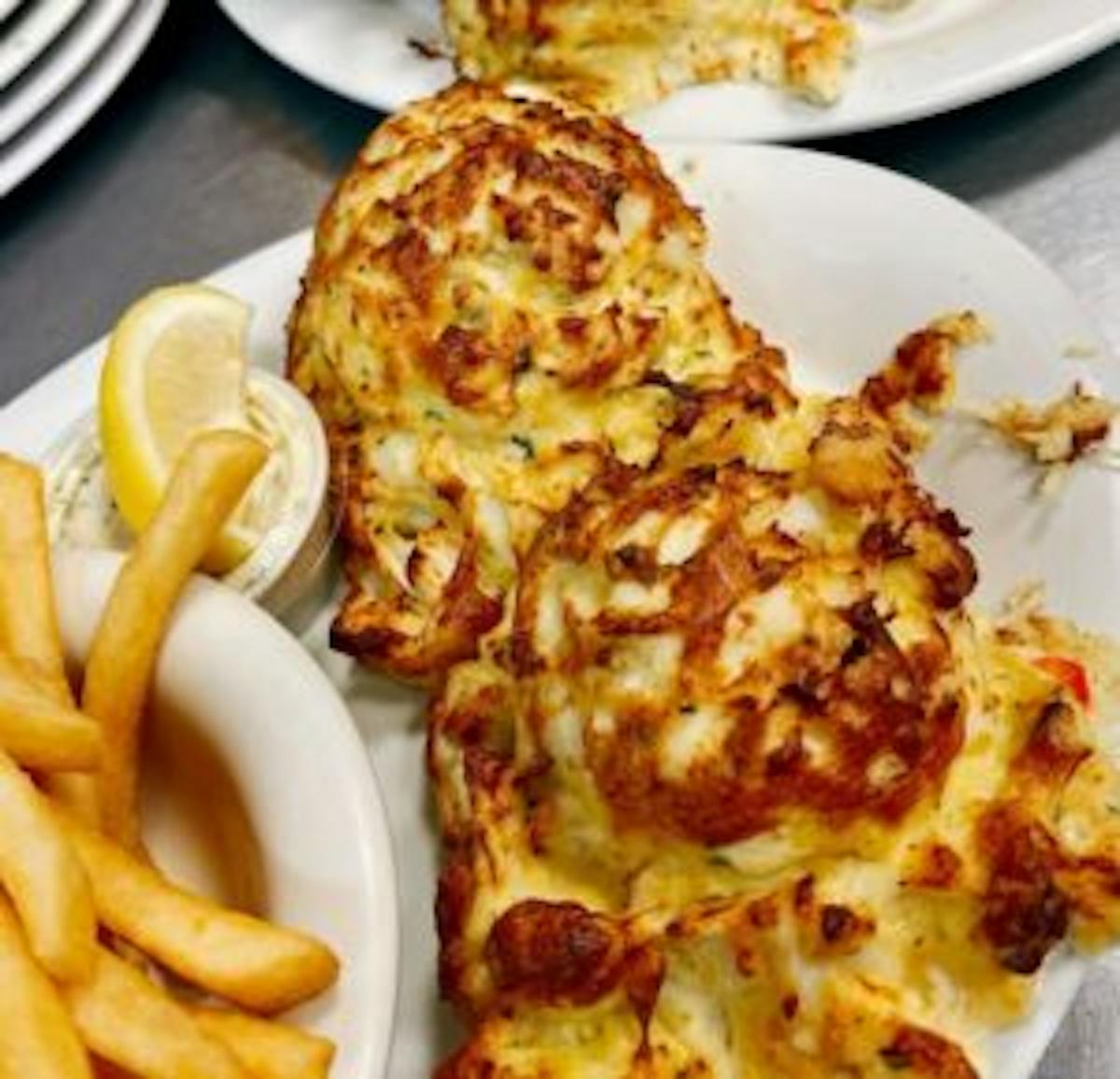 a meal of pizza and fries on a plate