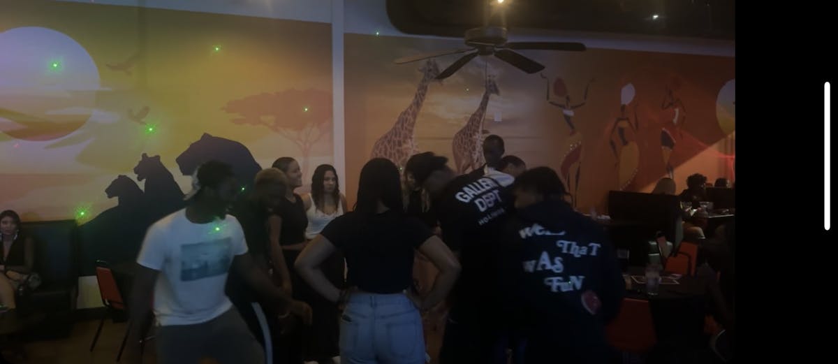 a group of people standing in a room