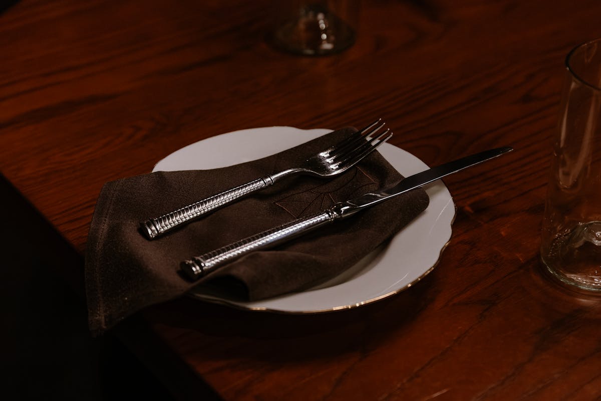 a pair of glasses sitting on top of a wooden table