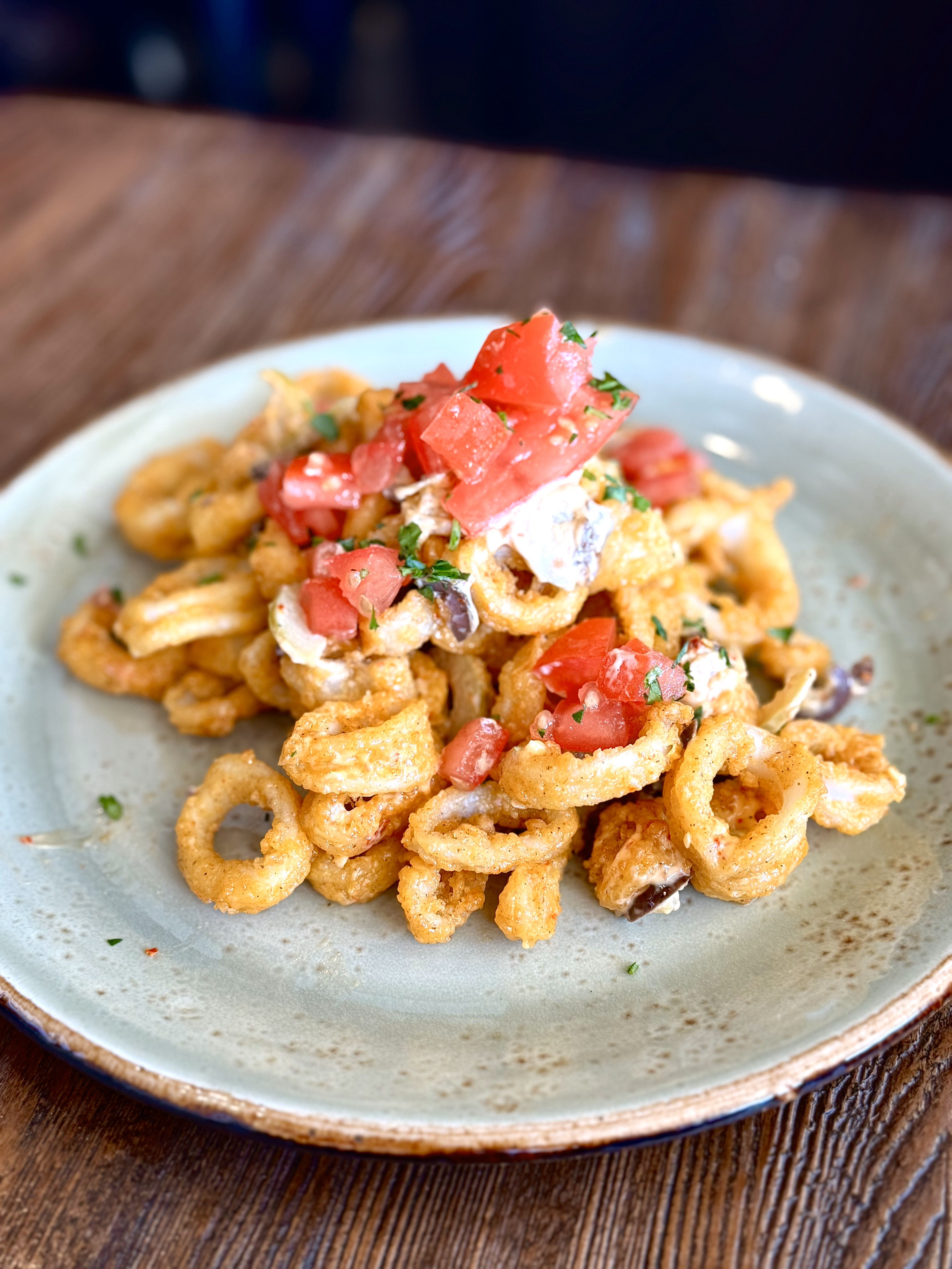 a plate with seafood and veggies on top