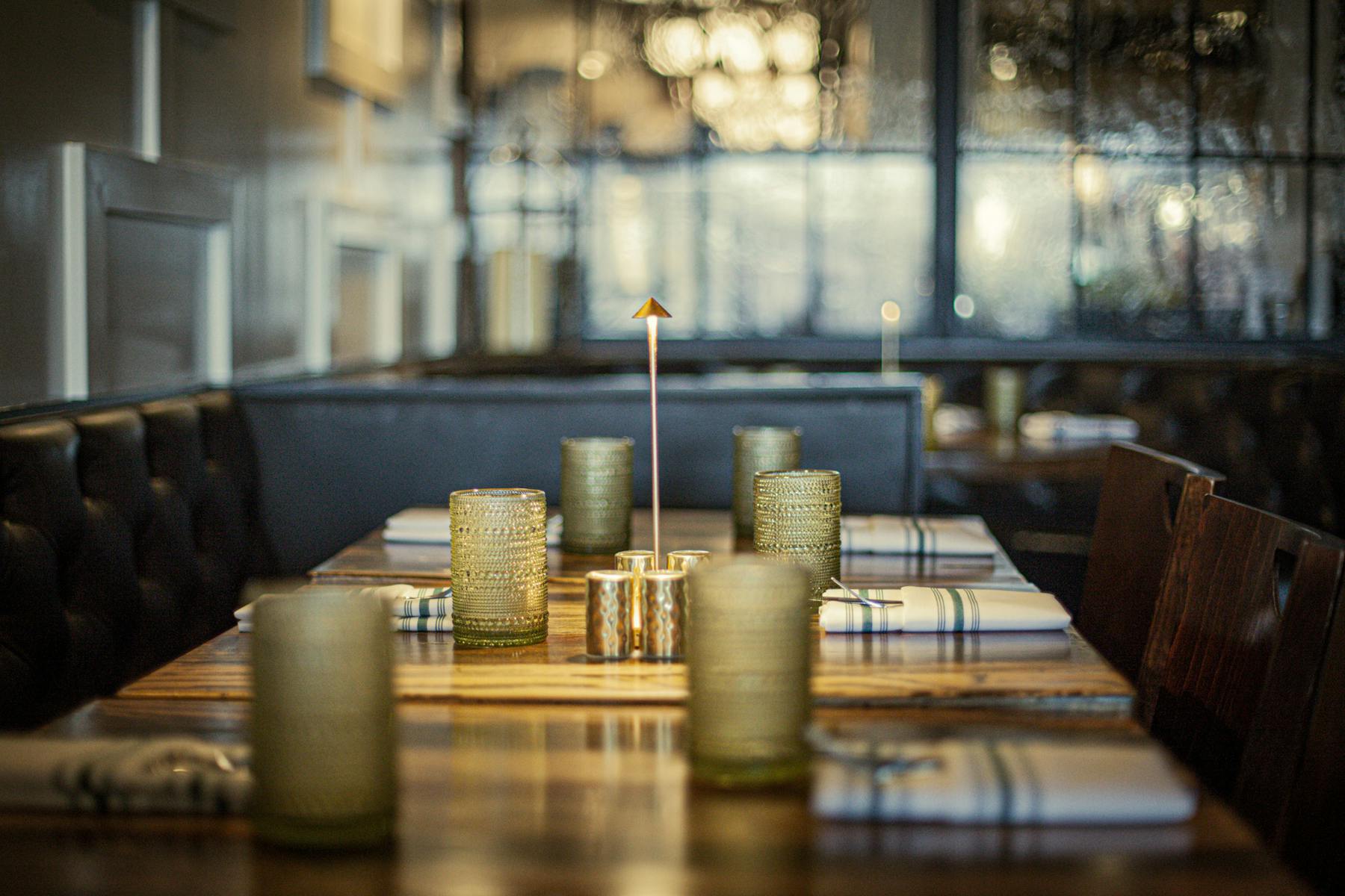 a room filled with furniture and vase on a table