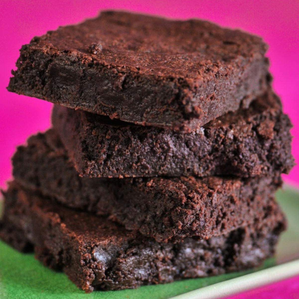 a close up of a piece of chocolate cake on a plate