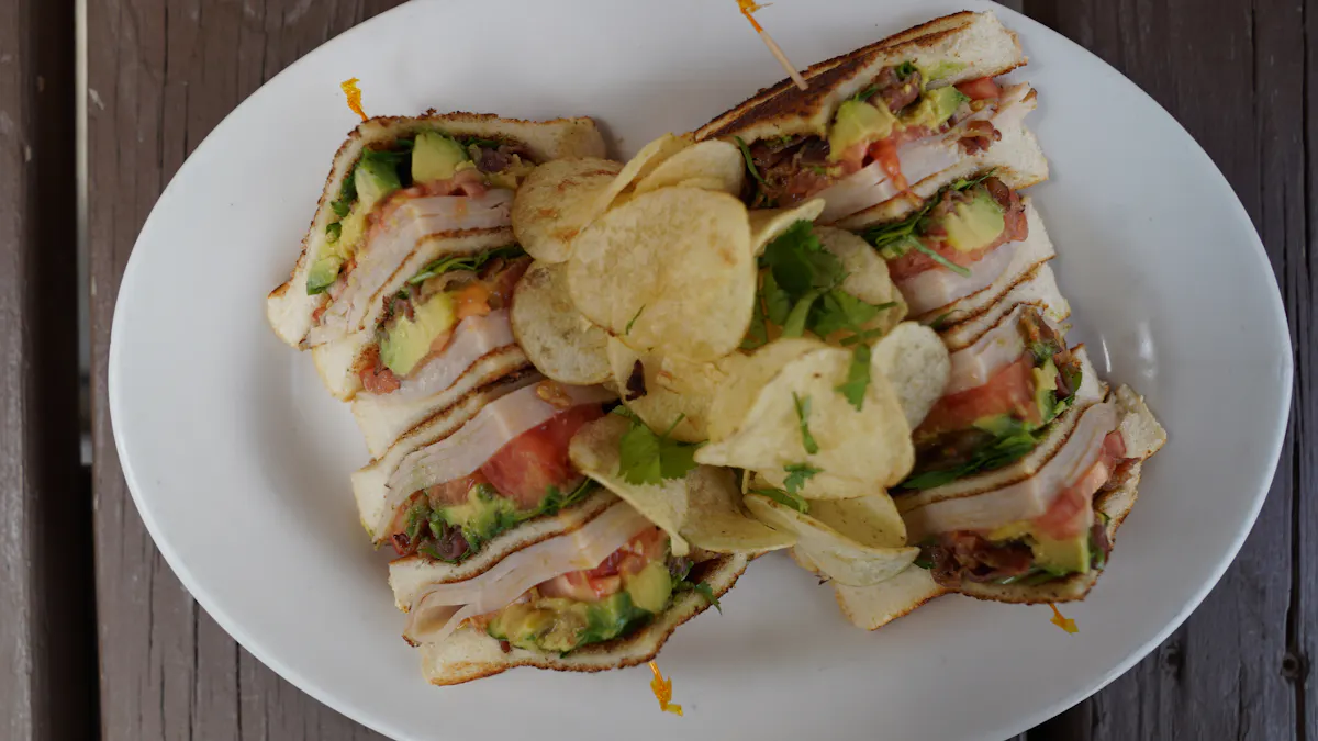 a white plate topped with a sandwich and a salad