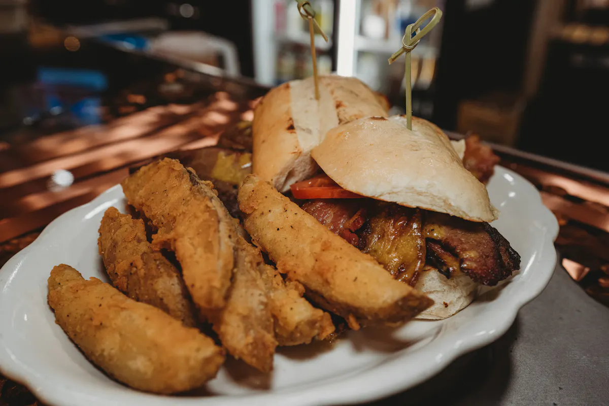 a chicken sandwich and fries on a plate
