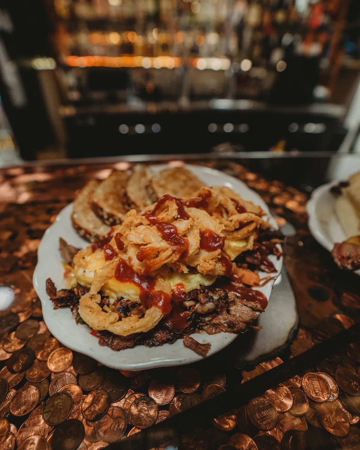 a plate of food with a slice of pizza
