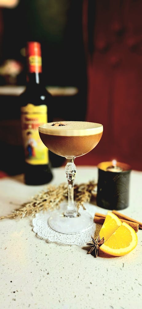 a close up of a wine glass sitting on a table