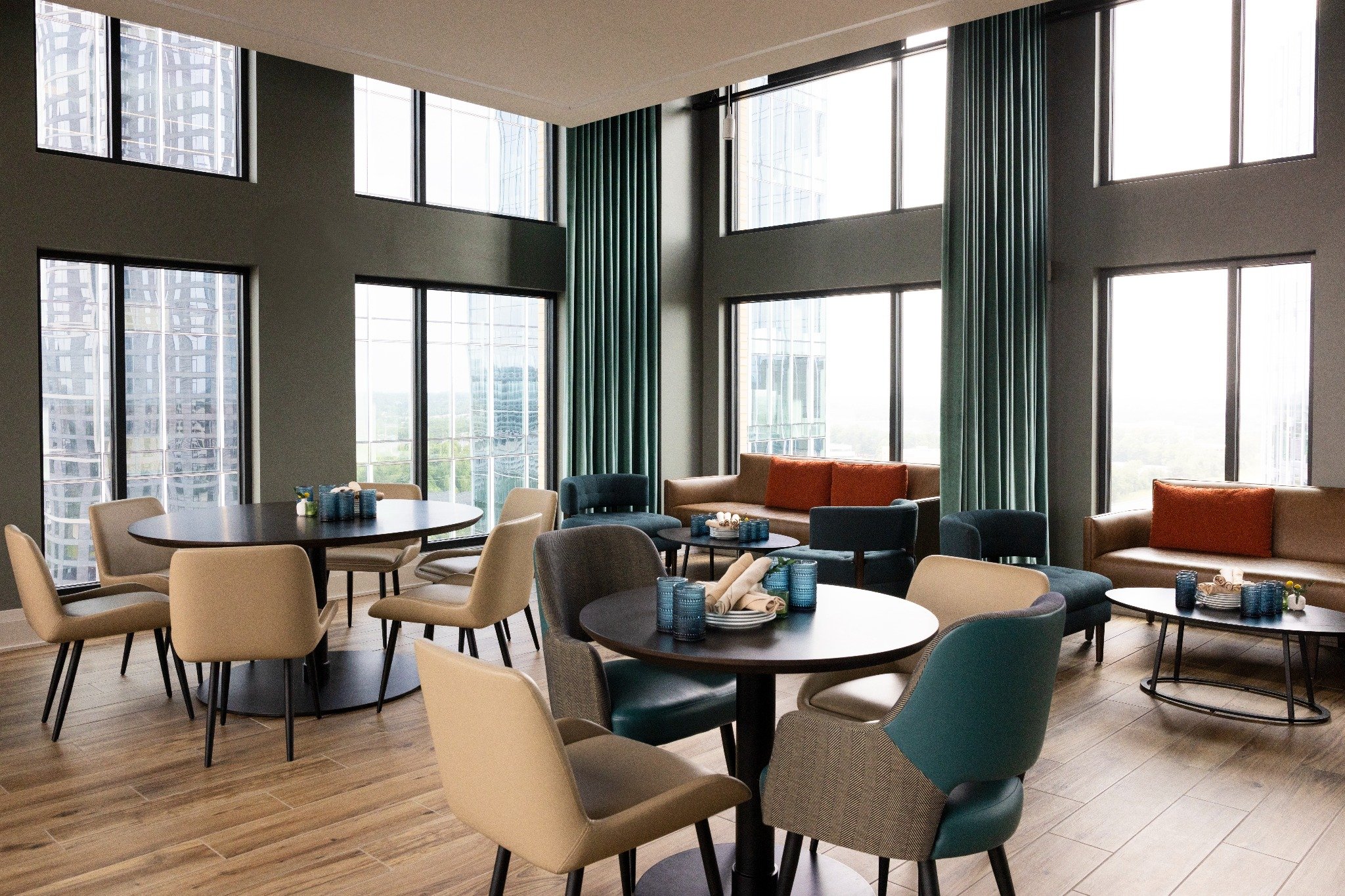 a living room filled with furniture and a large window