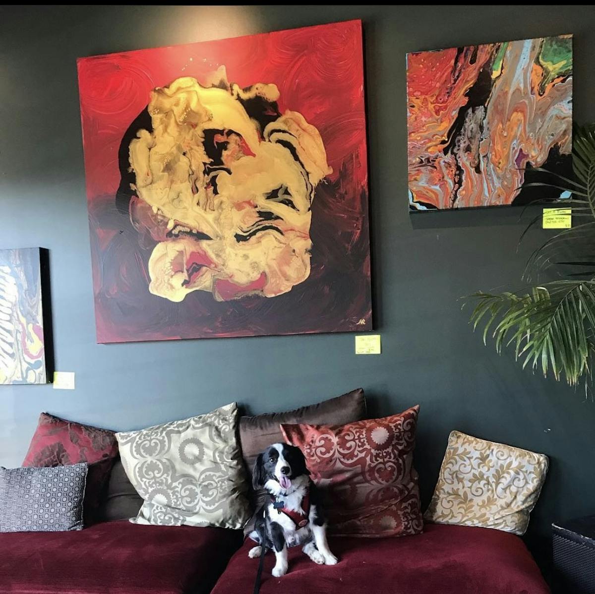 coffee nook at Crown Station with paintings & a dog