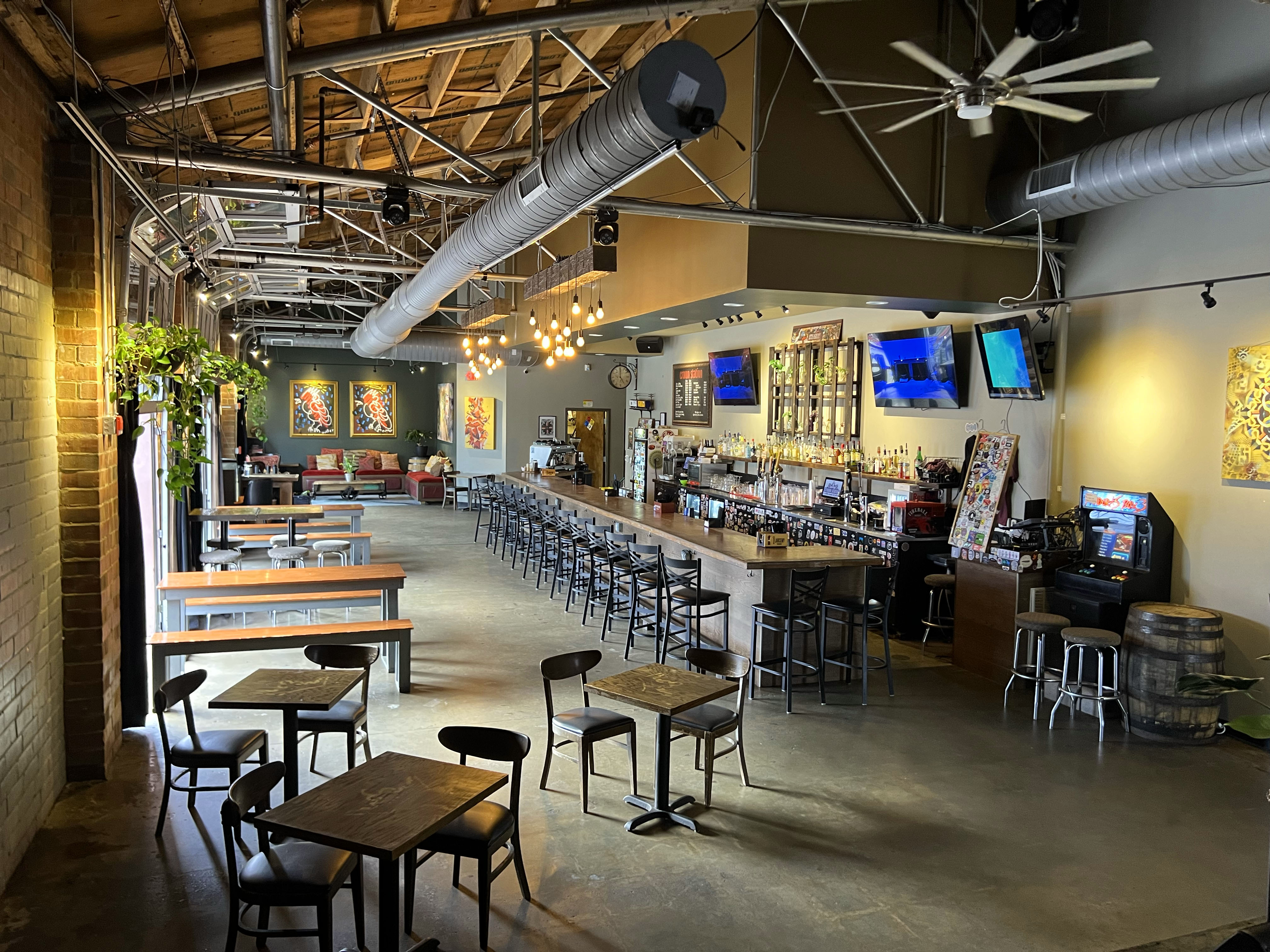 a room filled with furniture and a table in a restaurant