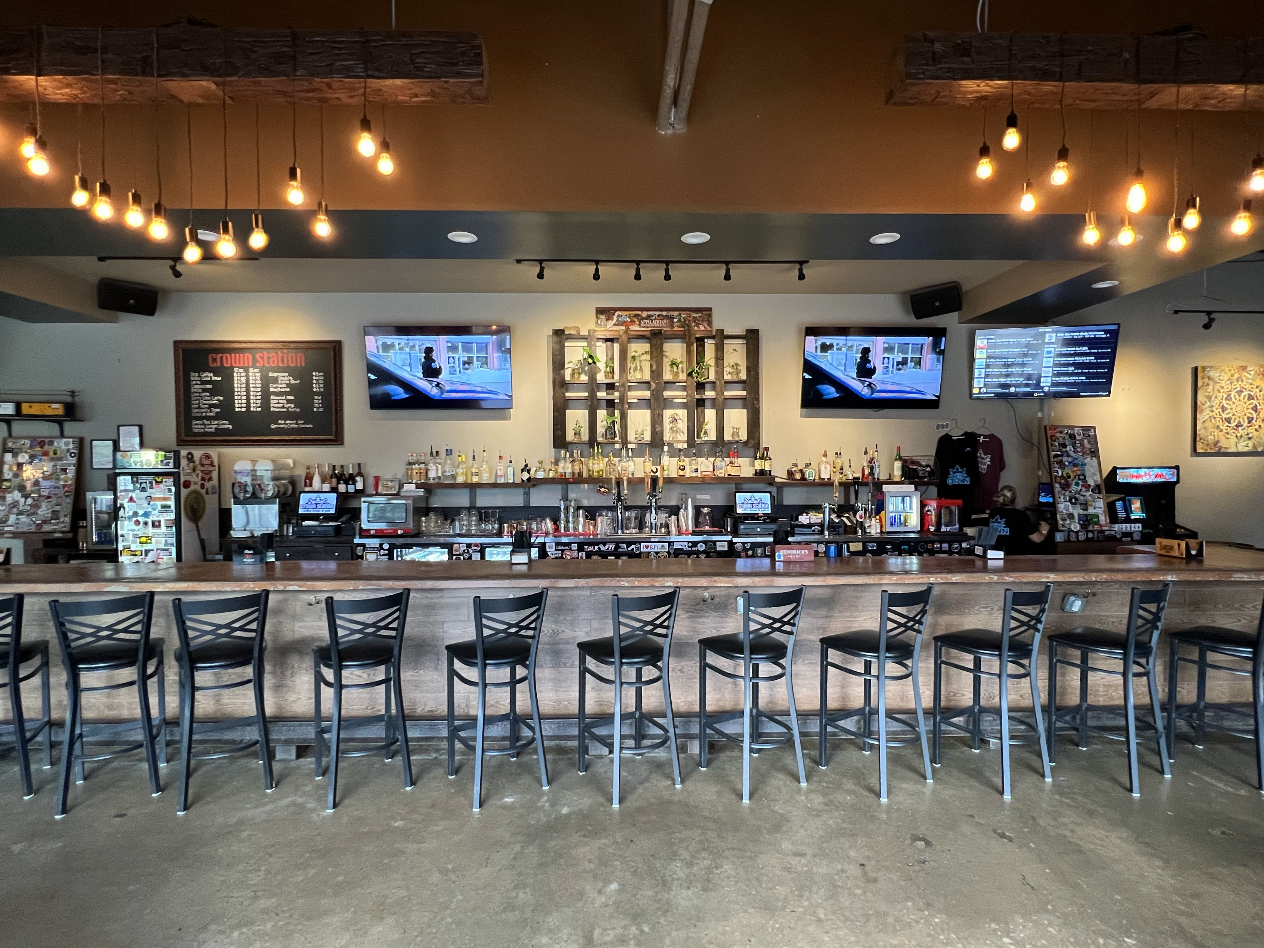 a group of people sitting at a table in a restaurant
