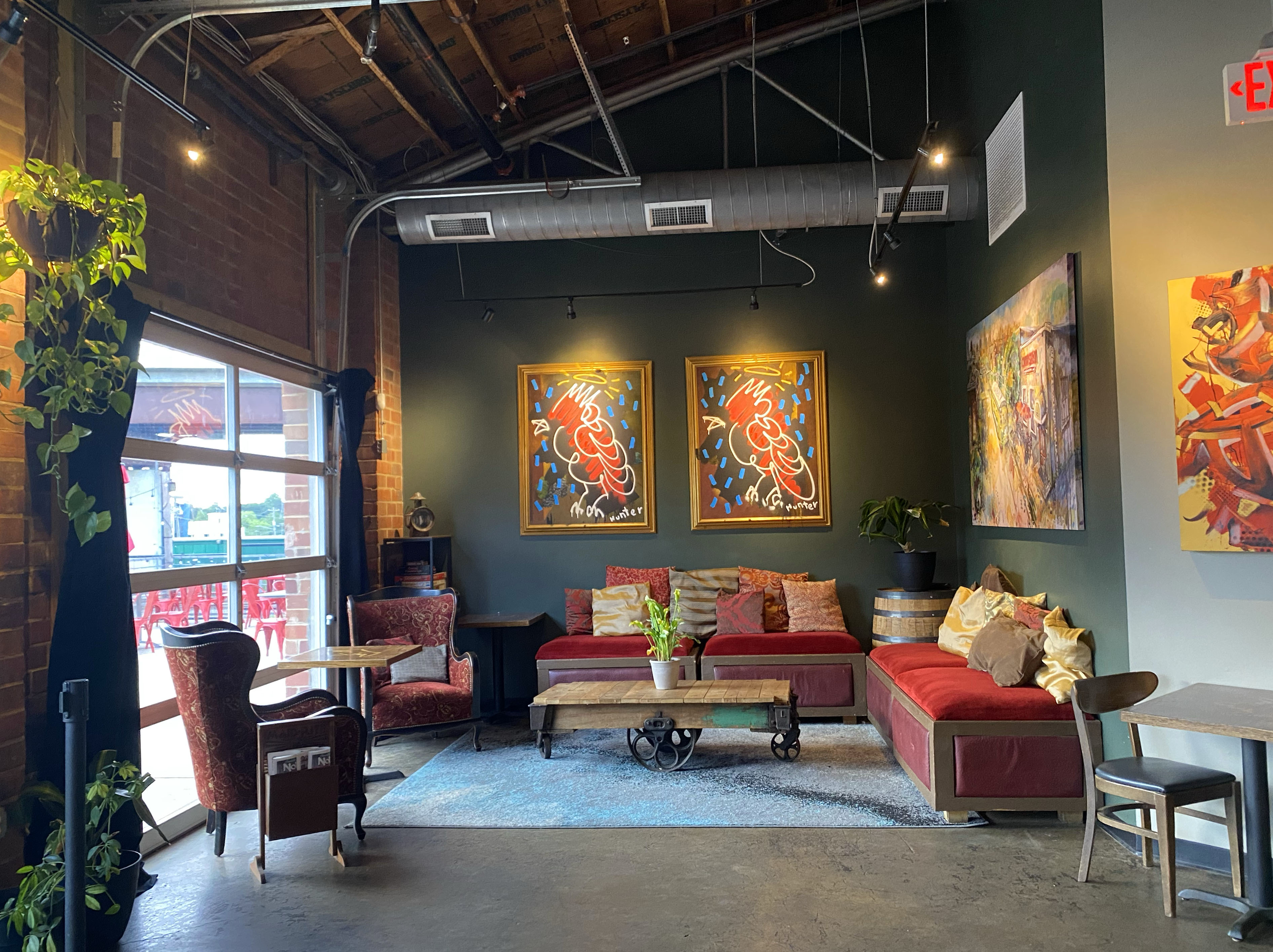 a living room filled with furniture and a fire place sitting in a chair