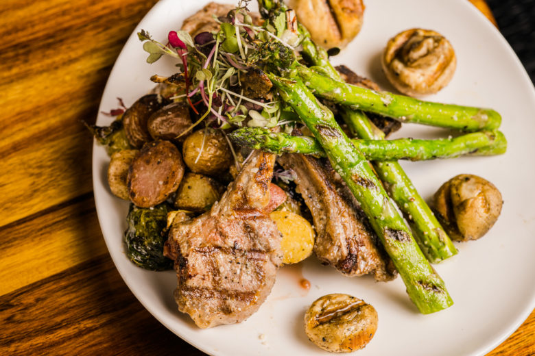a plate of food with meat and vegetables