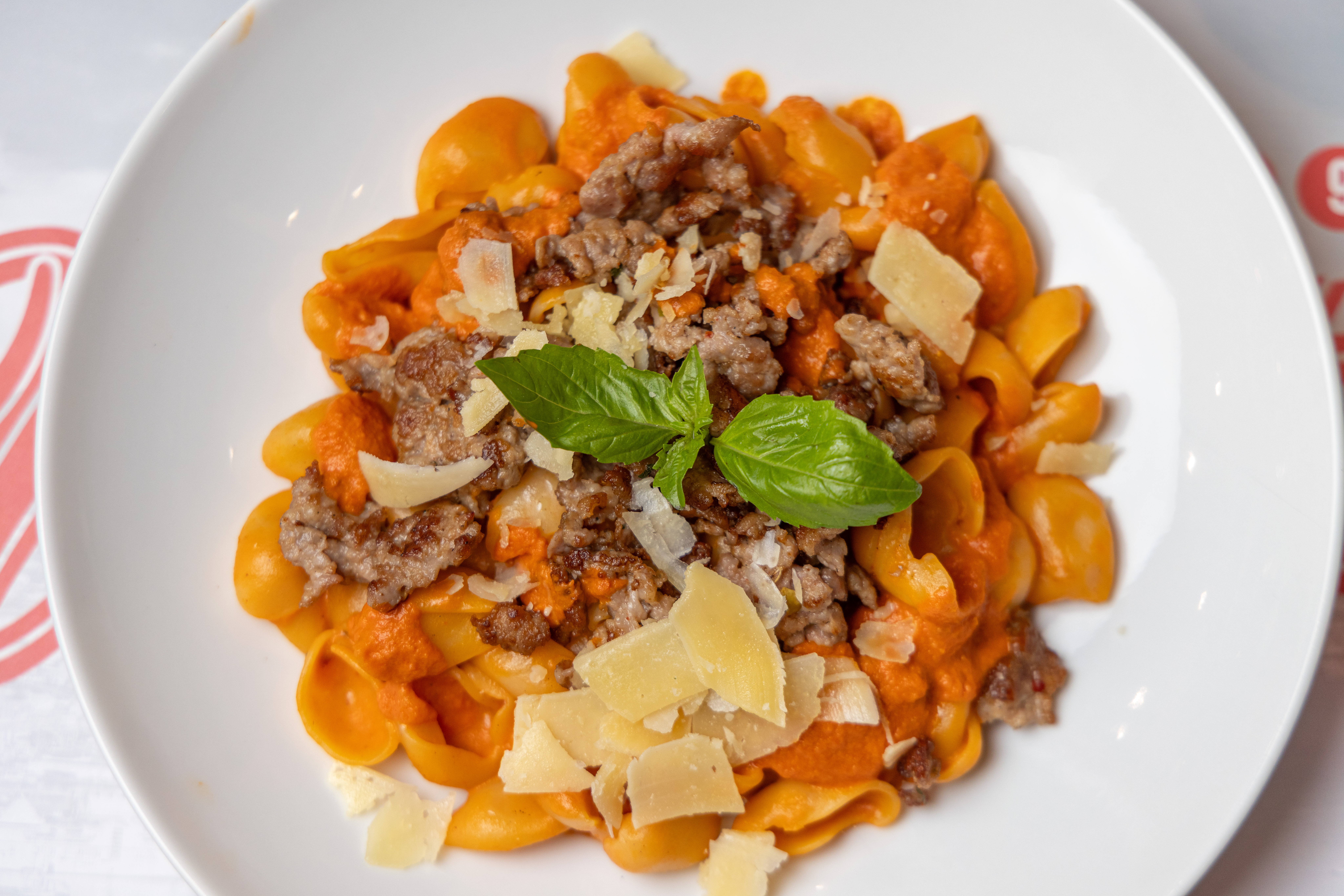 a plate of pasta with meat and cheese