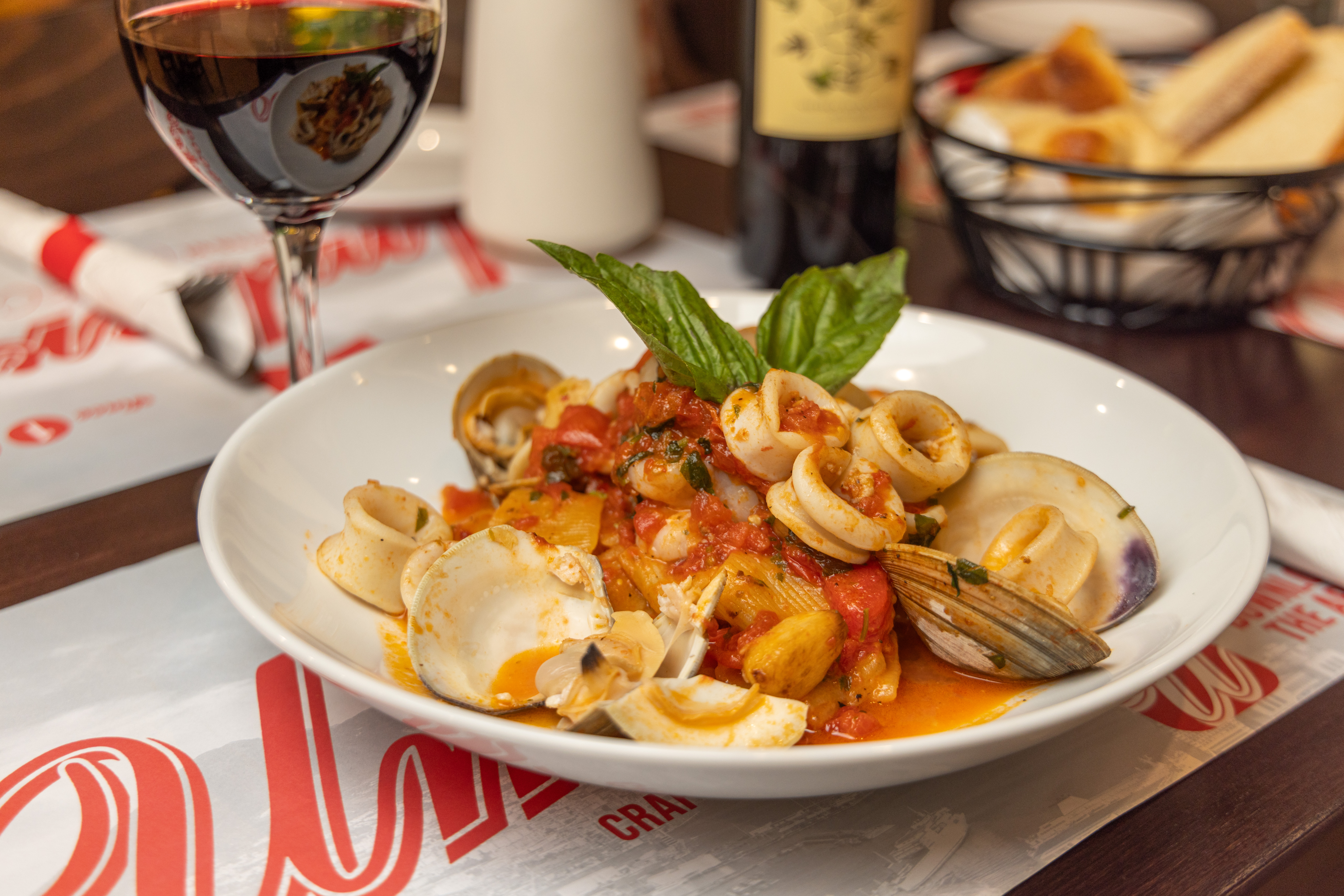 a plate of food with a glass of wine