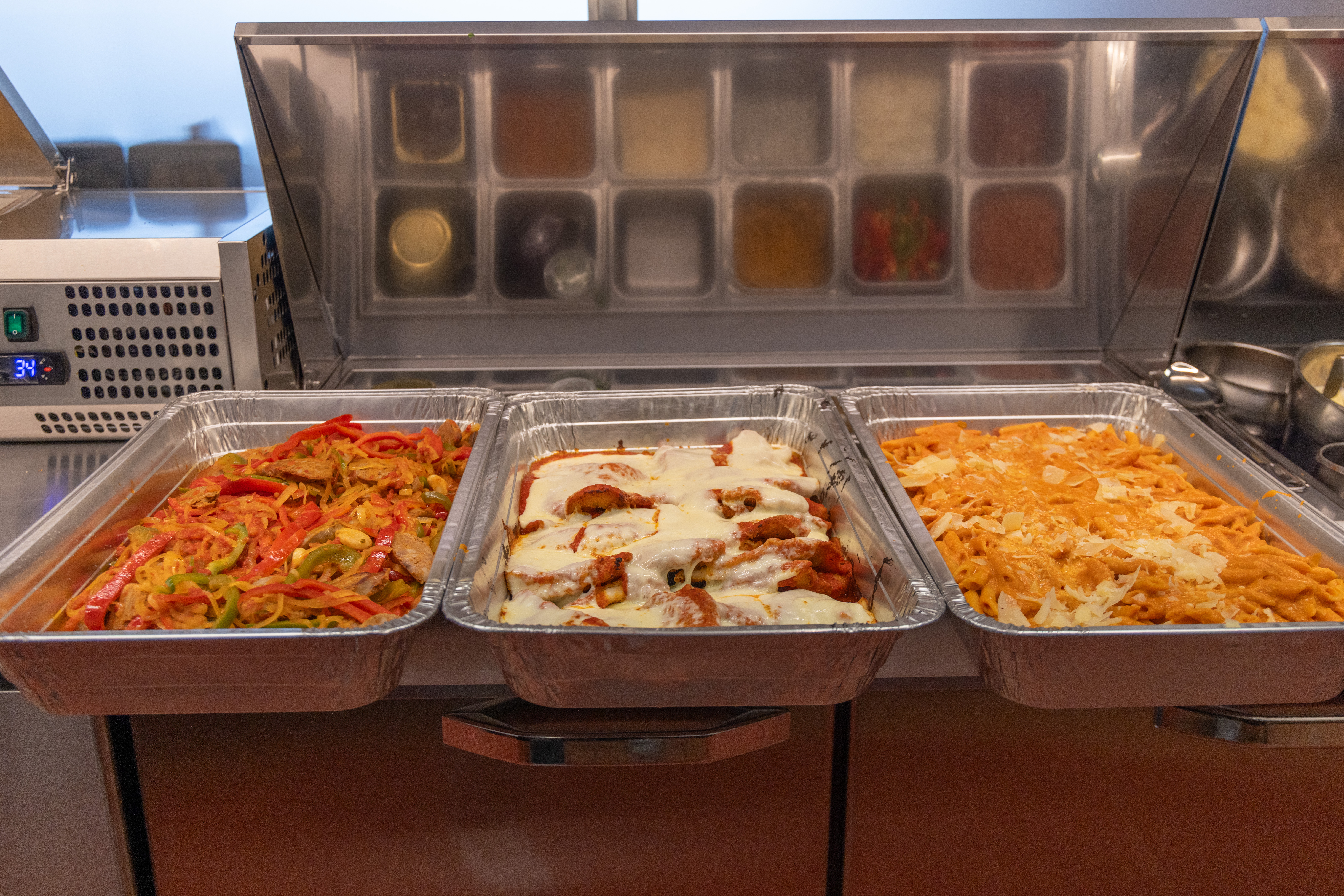 a trays of food in a buffet