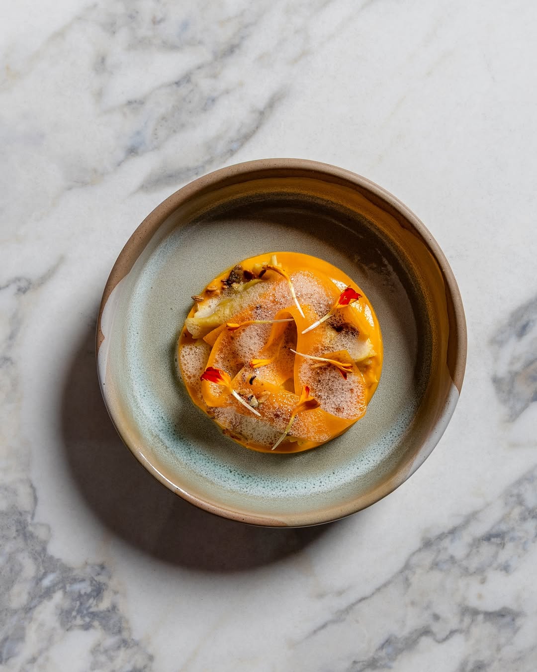 a plate of food on a marble surface