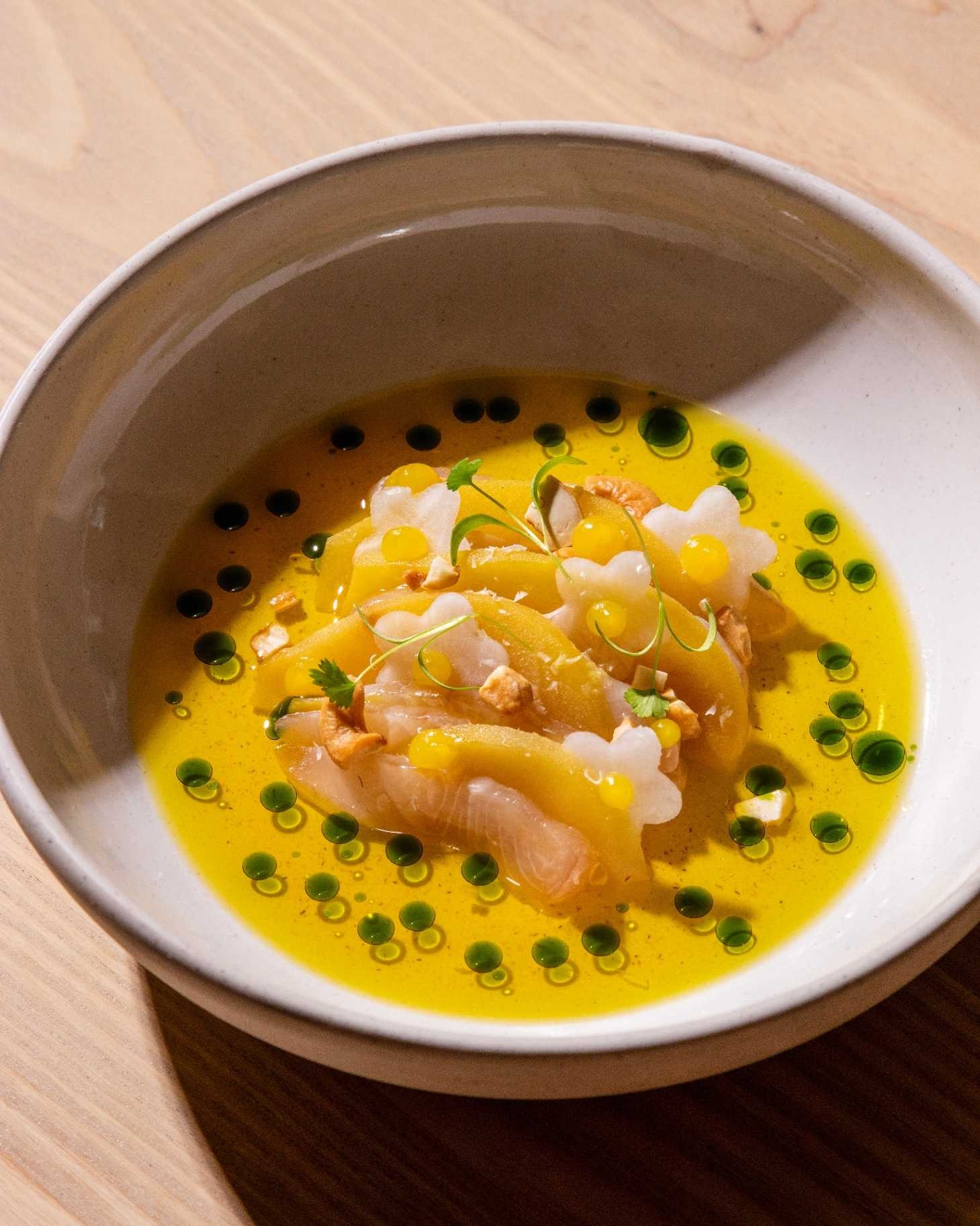 a bowl of soup with food in it