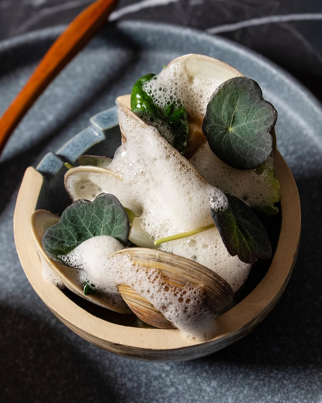 a plate of food on a wood table