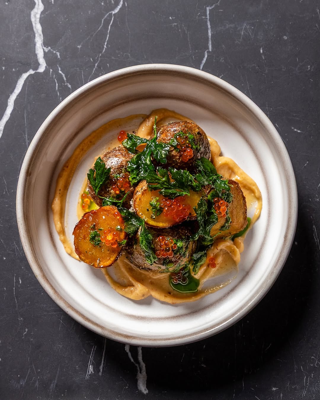 a plate of food on a marble surface