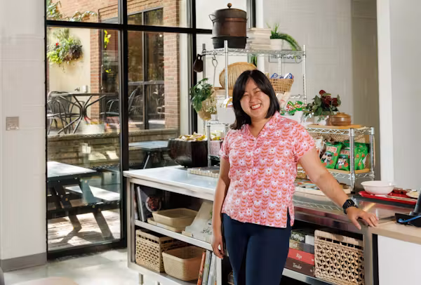 Chef Ji Hye Kim smiling in a market or storefront setting, guest chef for Echelon's September 15 Guest Chef Series dinner