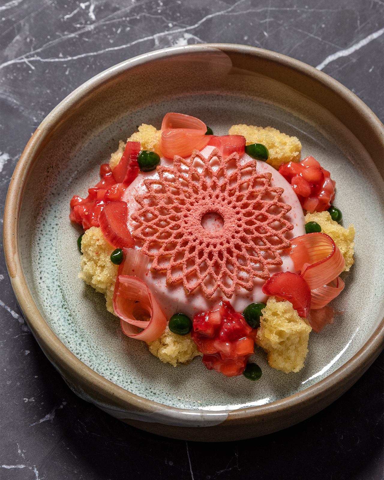 a plate of food on a marble surface