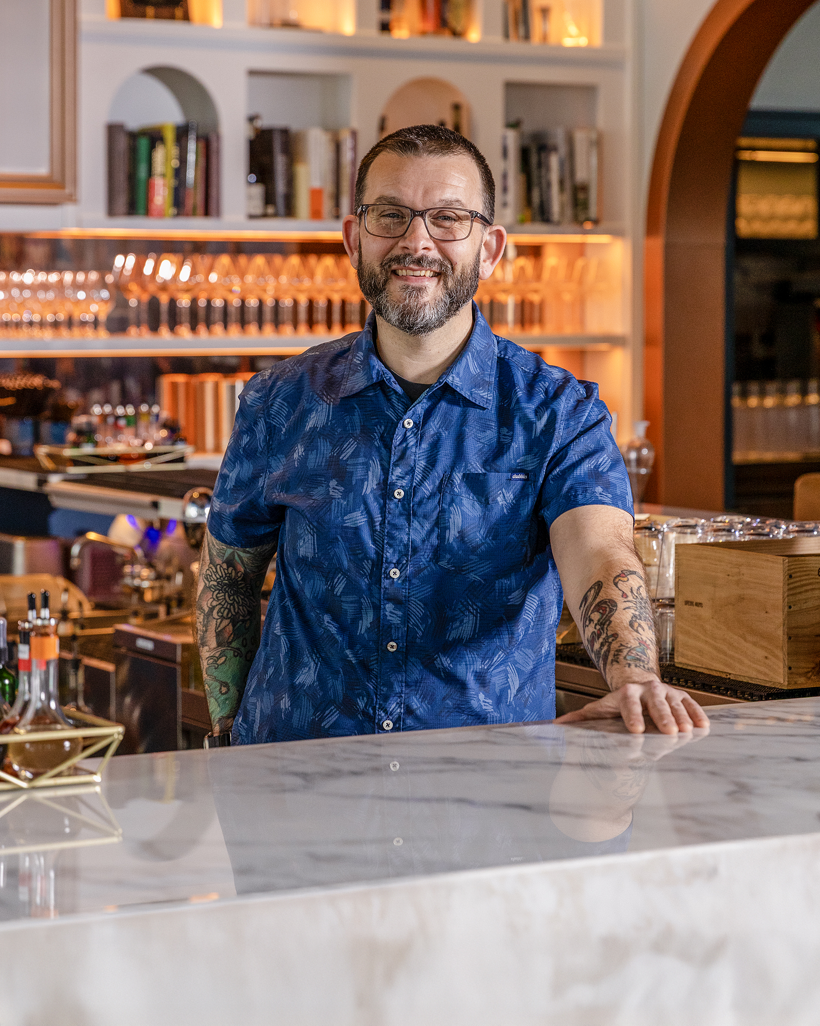 a man standing behind a counter