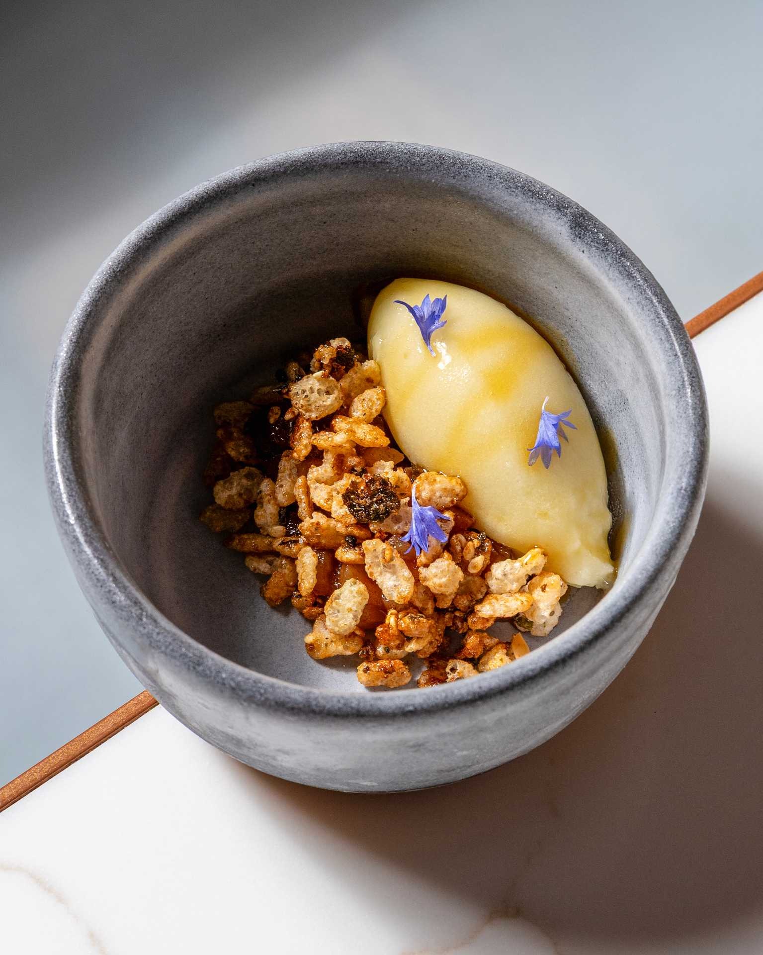 a bowl of food with flowers