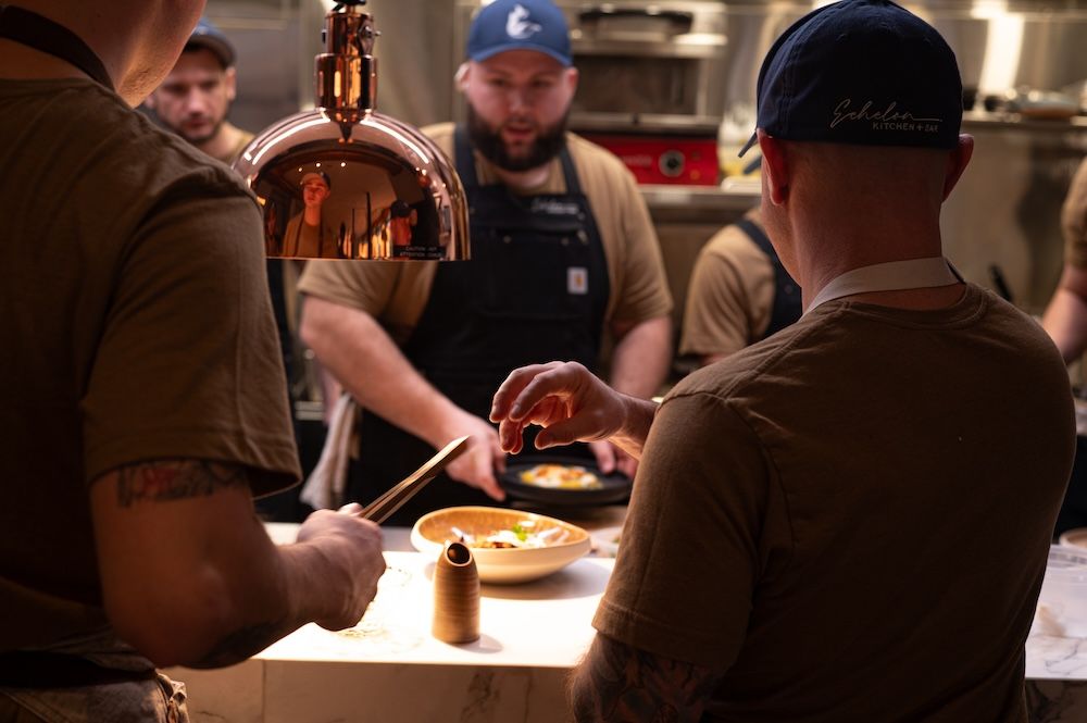 a group of men in a kitchen