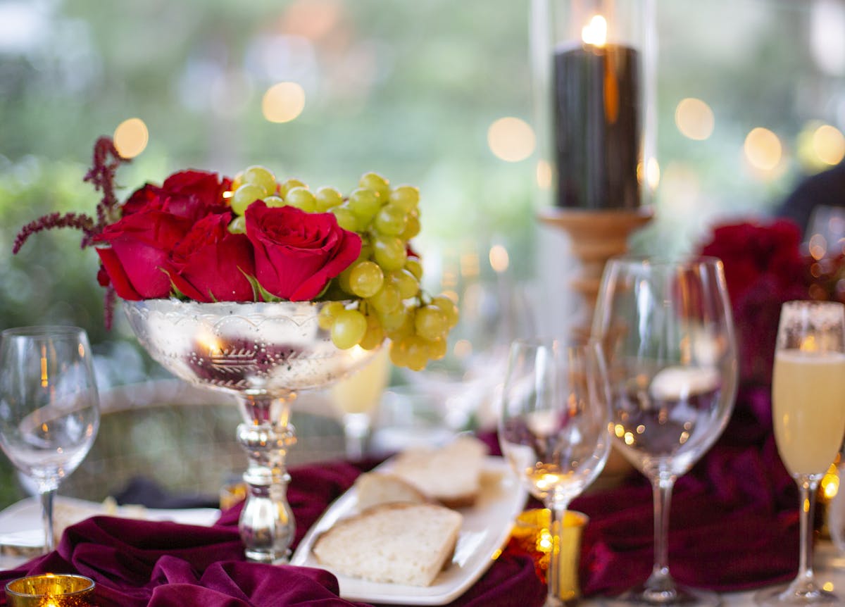 a table topped with glasses of wine