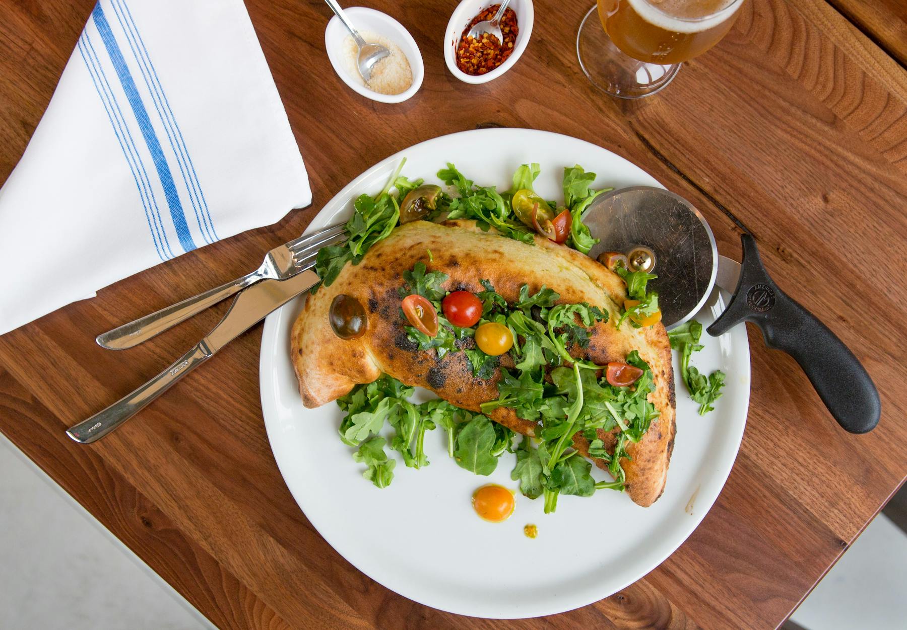 a plate of food sitting on top of a wooden table