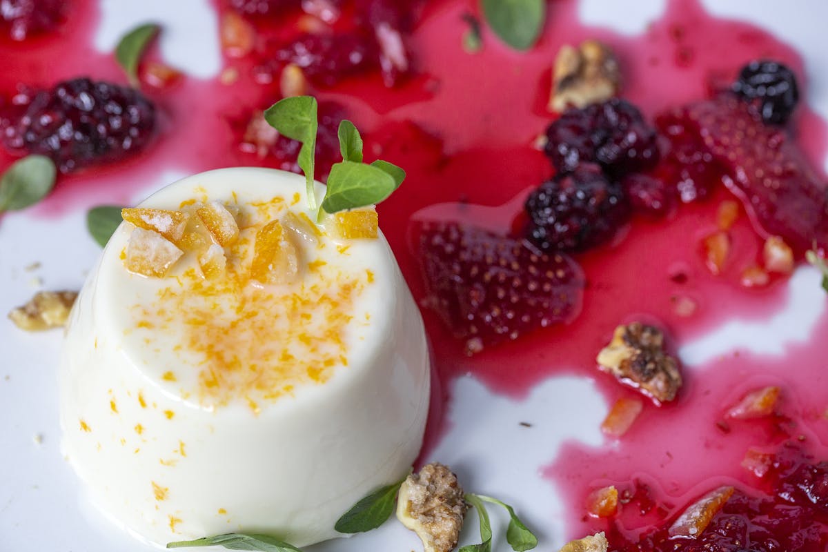 a white plate topped with fruit