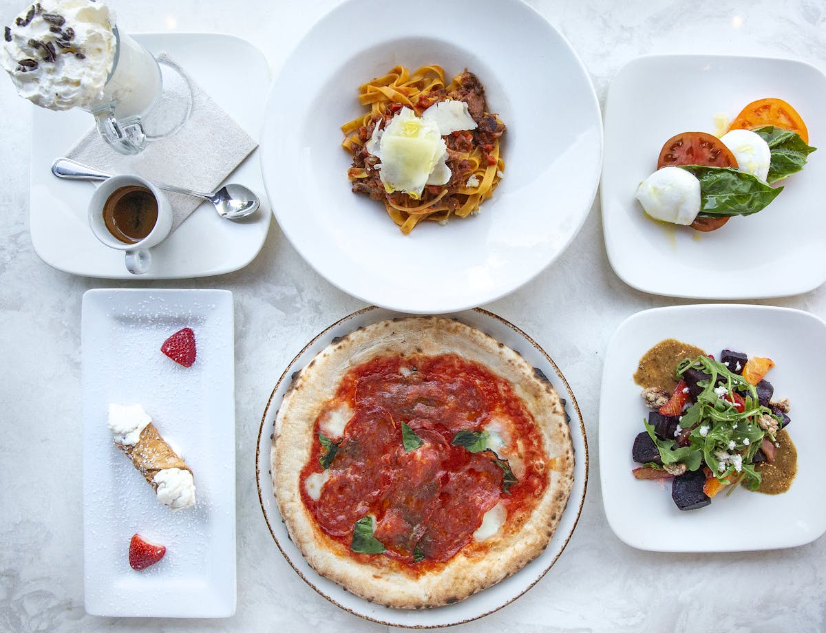 a white plate topped with different types of food on a table