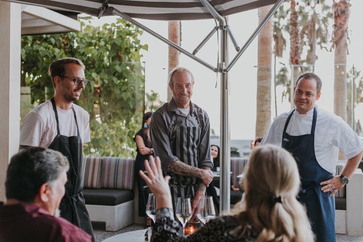 a group of people standing in front of a building