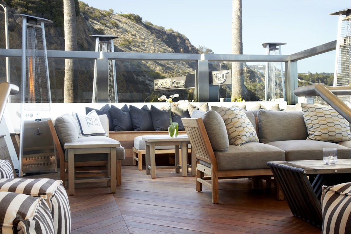 a living room filled with furniture and a large window