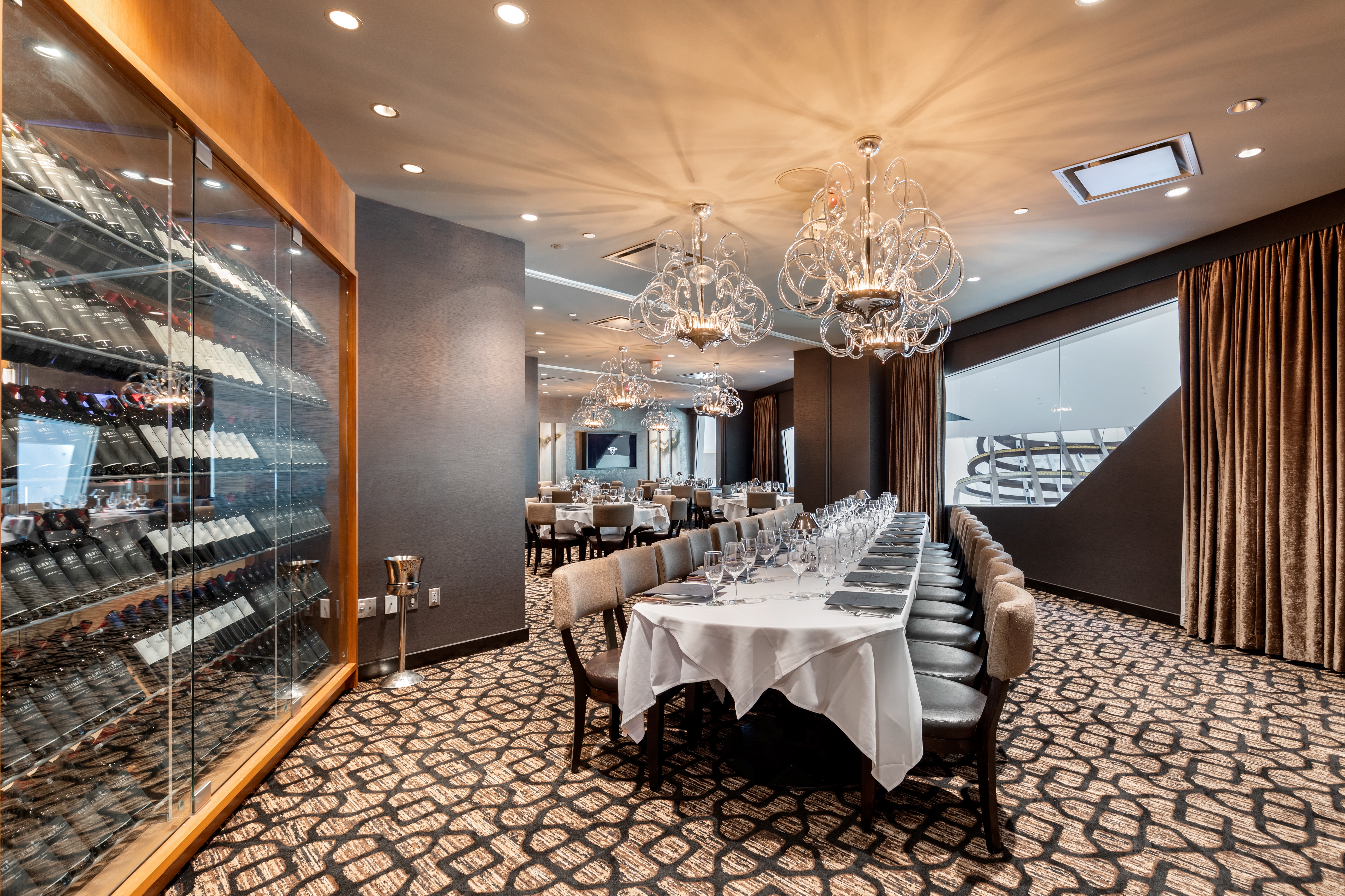 a bedroom with a bed and a chair in a room