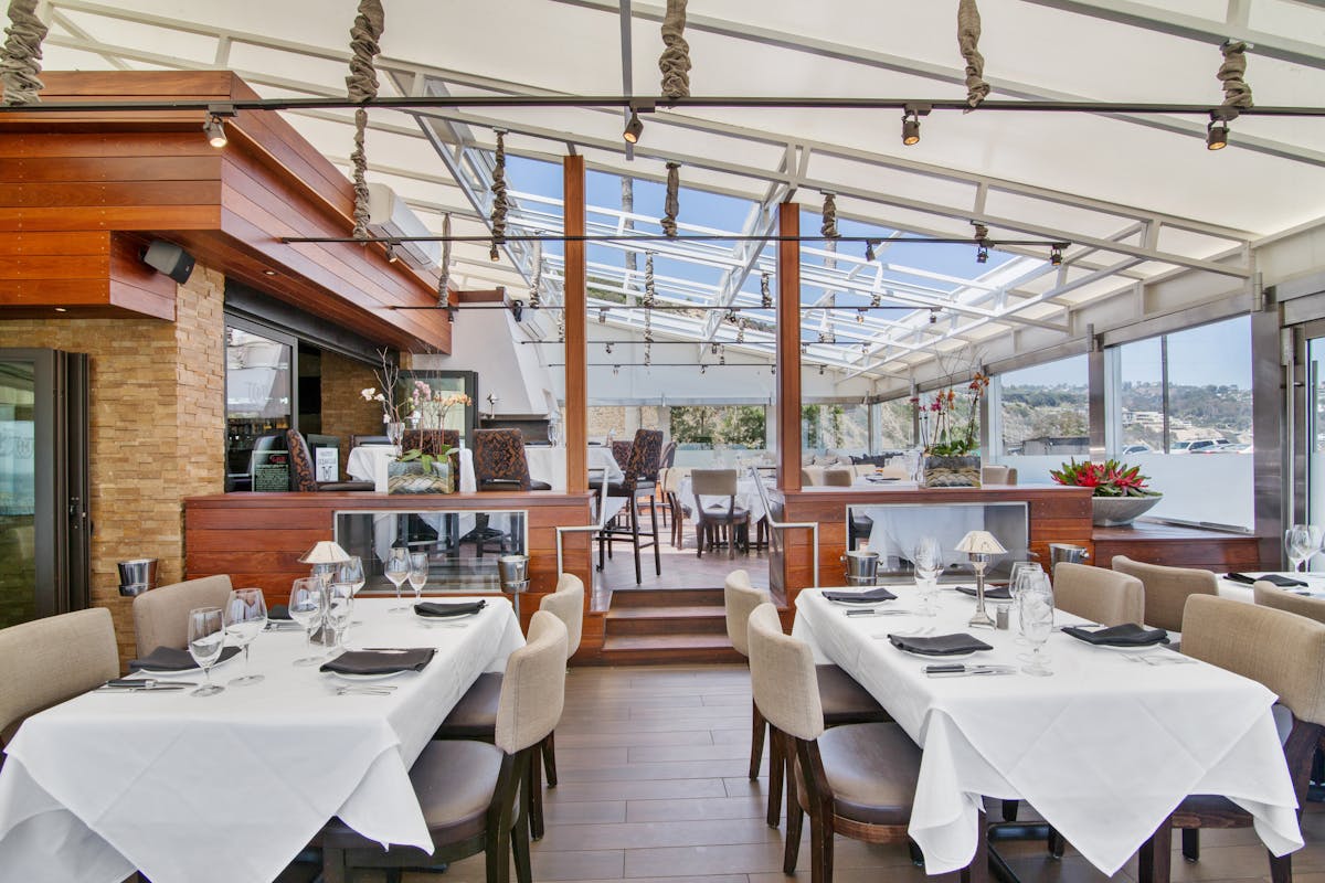 a dining room table in front of a building