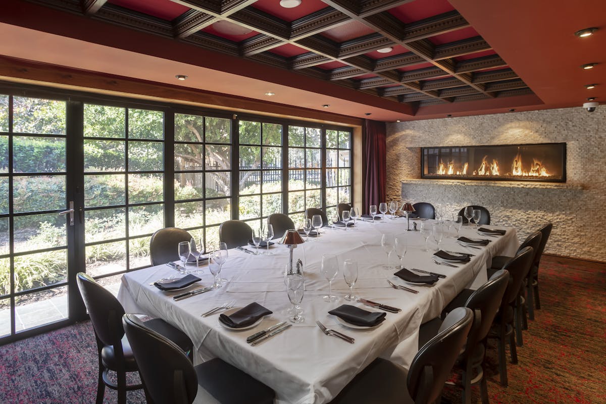 a dining room table in front of a window