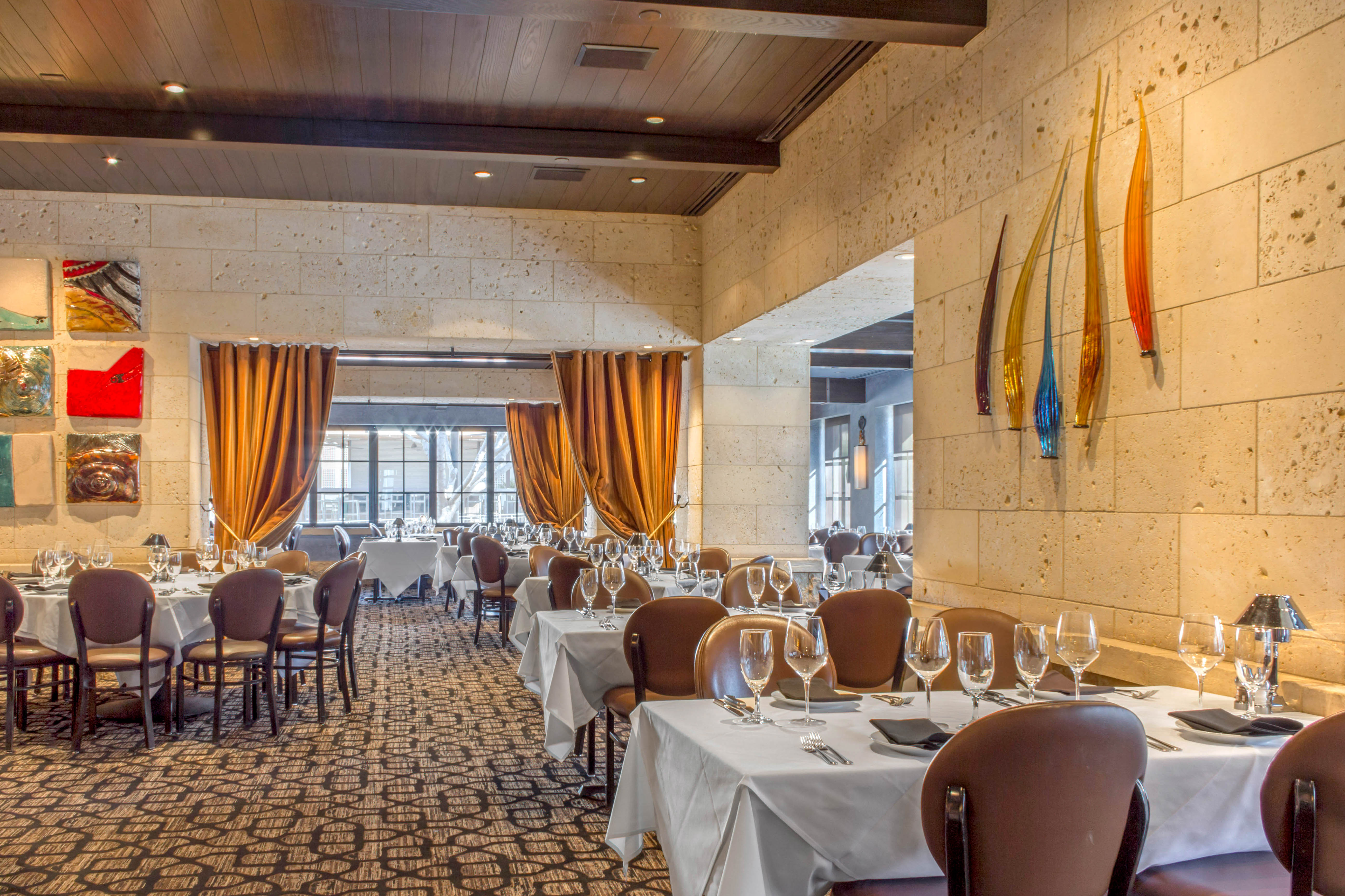 a room filled with furniture and a large window