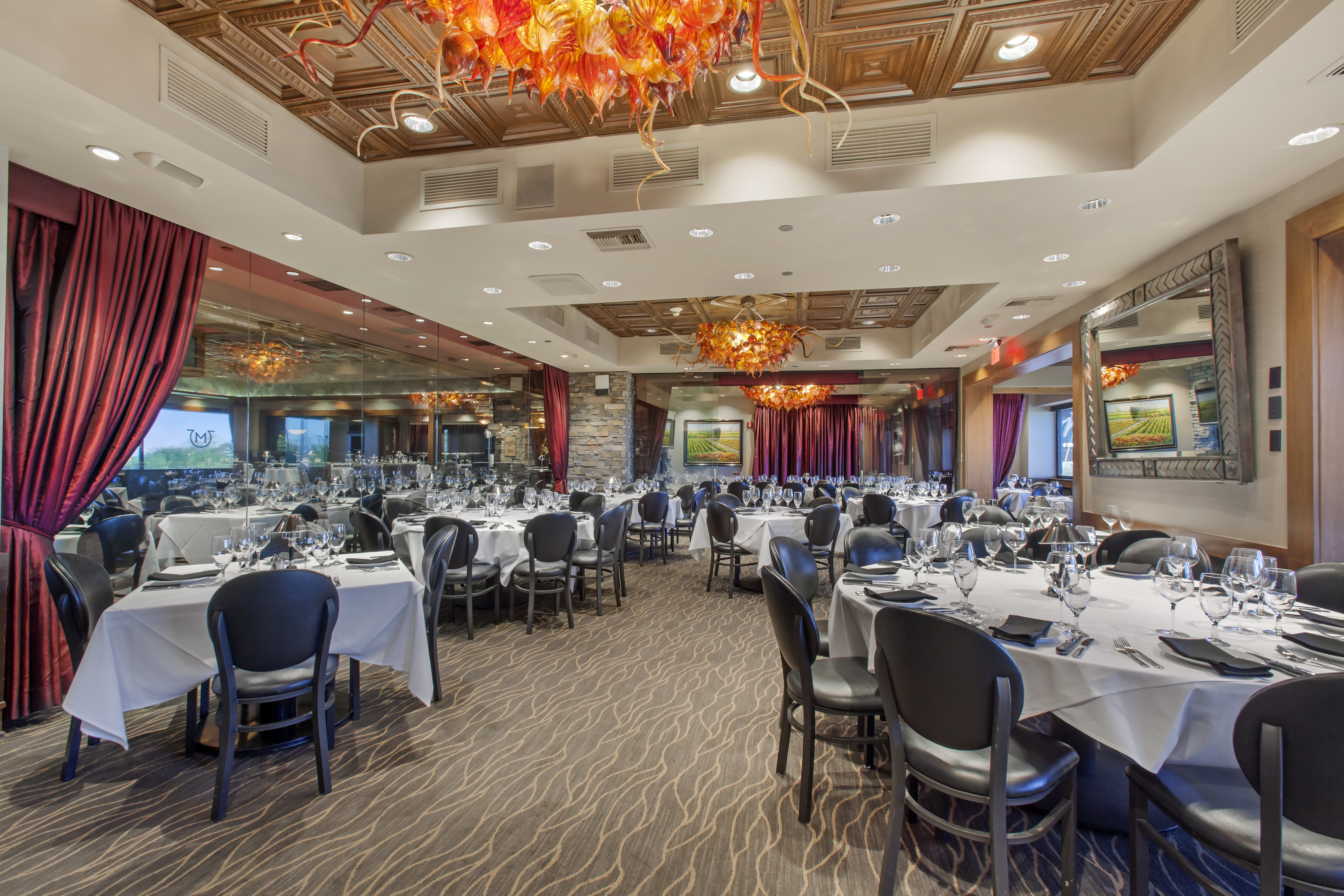 a room filled with furniture and a large mirror