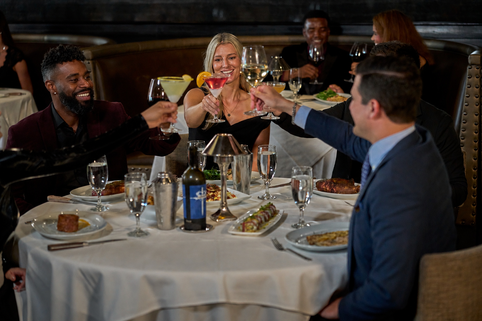 Mastro's guests cheering their cocktails